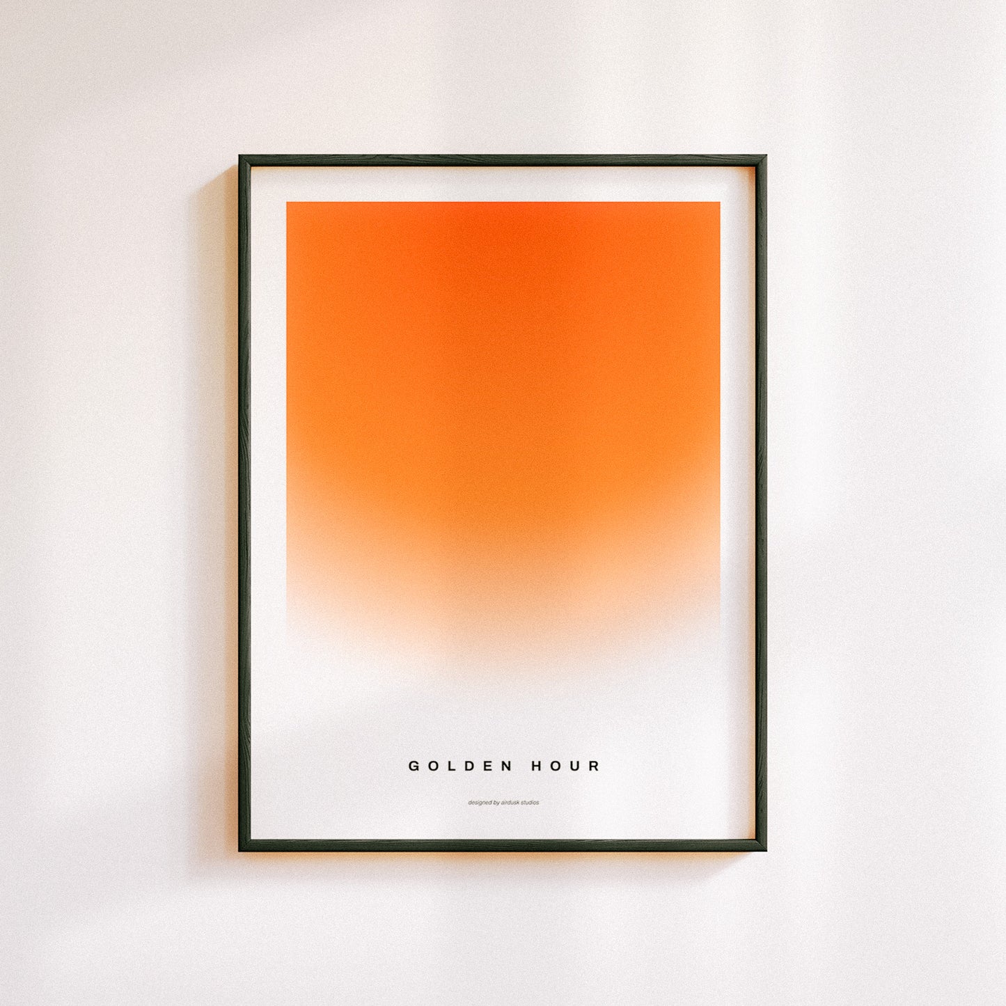 Minimal poster art home decor with text "GOLDEN HOUR" alongside a warm gradient portraying a sunset in a midcentury modern / retro design.