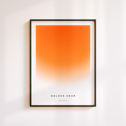 Minimal poster art home decor with text "GOLDEN HOUR" alongside a warm gradient portraying a sunset in a midcentury modern / retro design.