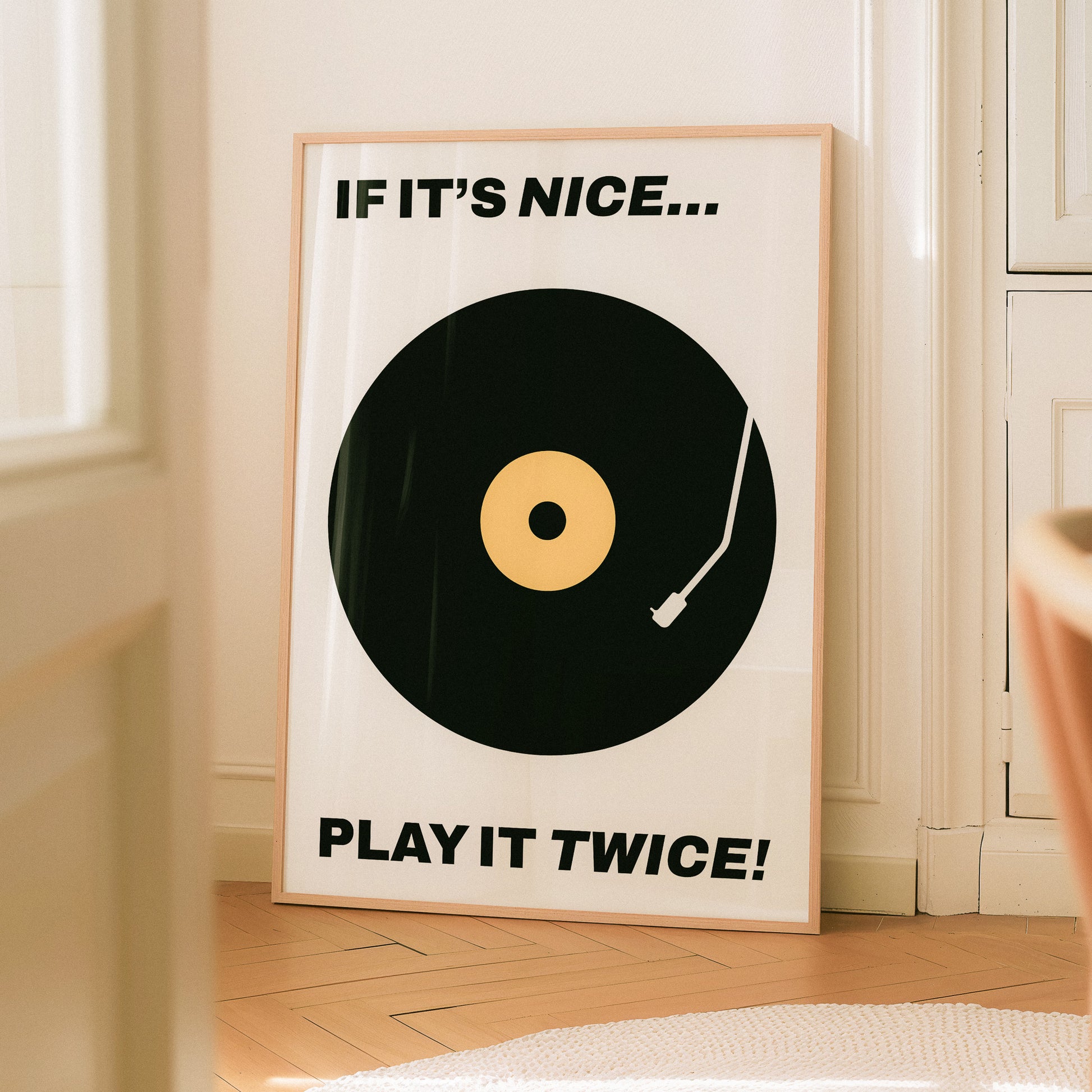 Typography music poster home decor with text "If it's nice...play it twice" in a minimal, retro, and midcentury modern design.