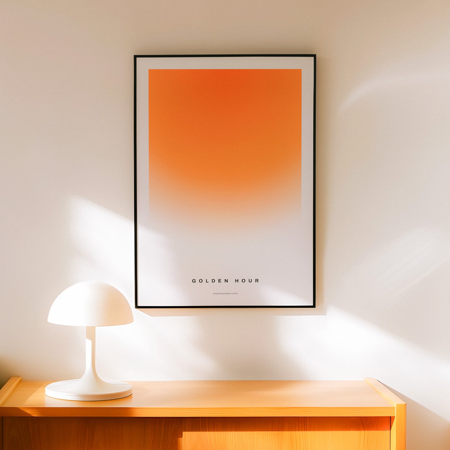 Minimal poster art home decor with text "GOLDEN HOUR" alongside a warm gradient portraying a sunset in a midcentury modern / retro design.