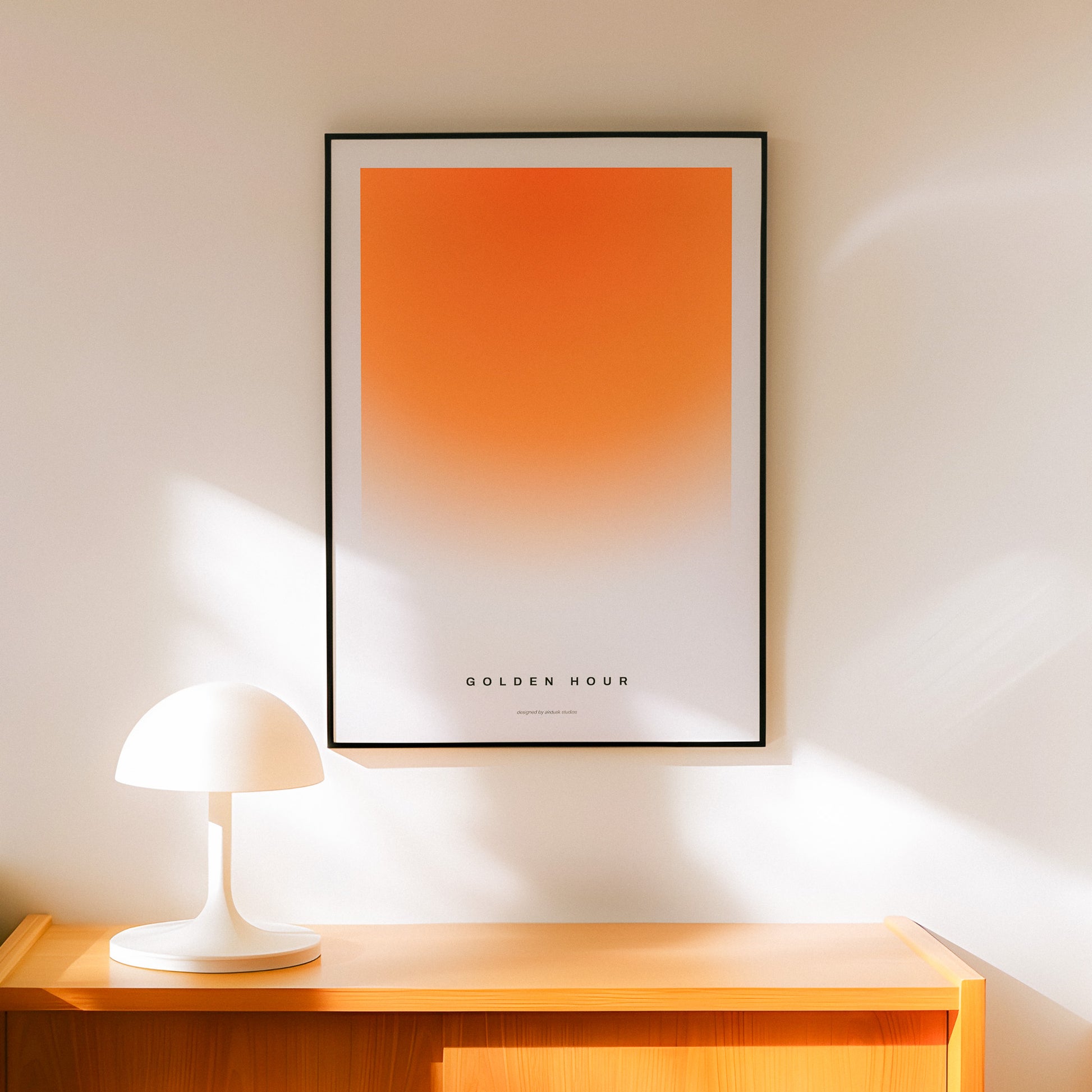 Minimal poster art home decor with text "GOLDEN HOUR" alongside a warm gradient portraying a sunset in a midcentury modern / retro design.